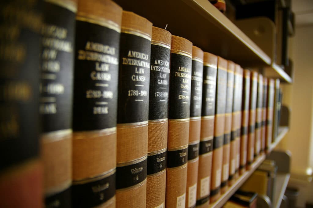 Row of old law books on a shelf.