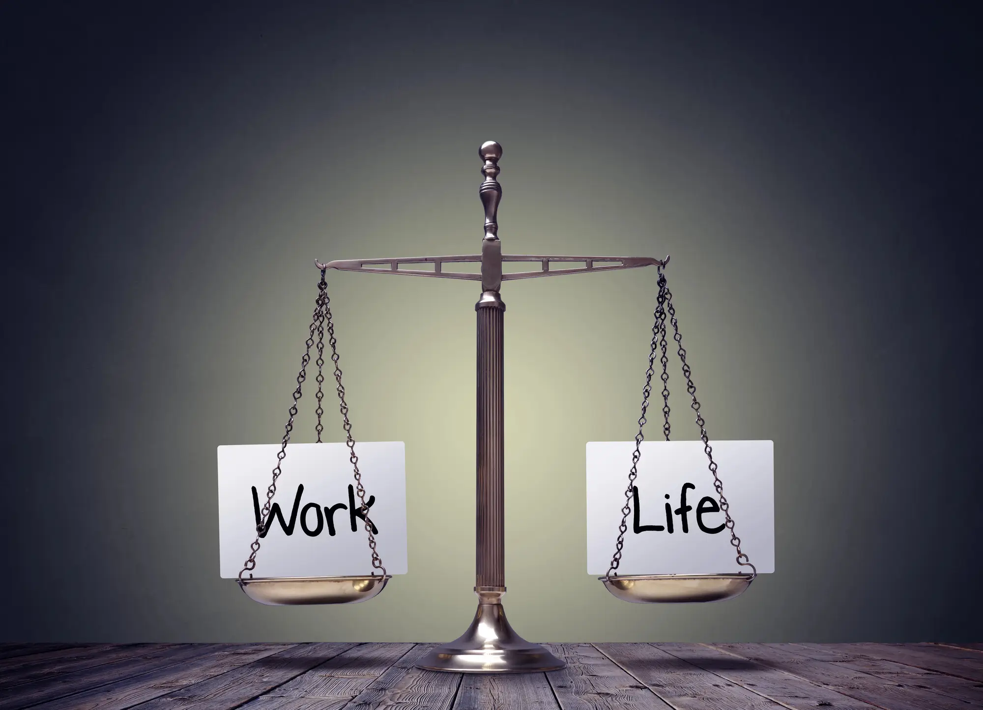 Justice scales balancing life and work, symbolizing the importance of work life balance in business for the modern world.