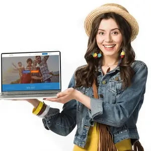 A smiling woman in a hat holding a laptop with a beautiful WordPress website design process displayed on the screen.